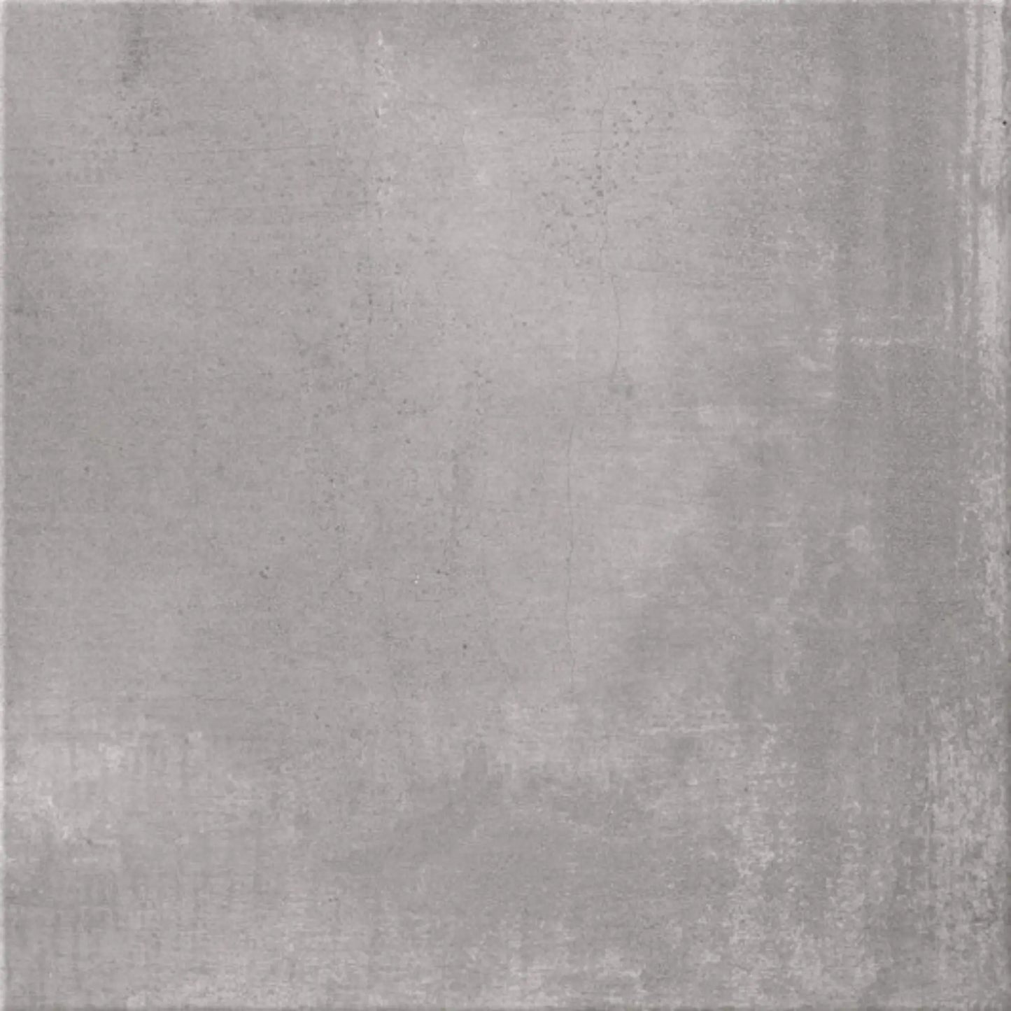 alt='Pavimento quadrado de 60x60cm em grés porcelânico com efeito de cimento em tom de cinza claro mate.'
