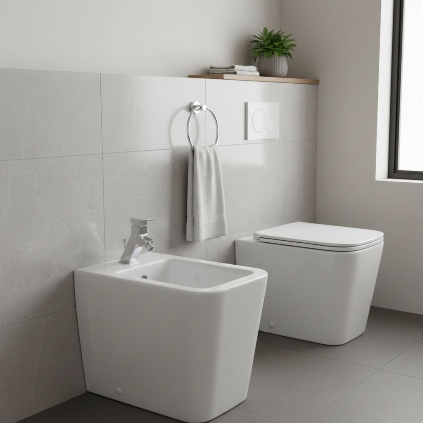 Ambiente de casa de banho moderna com bidé e sanita de pousar da série Advance da Sanindusa em cerâmica branca.