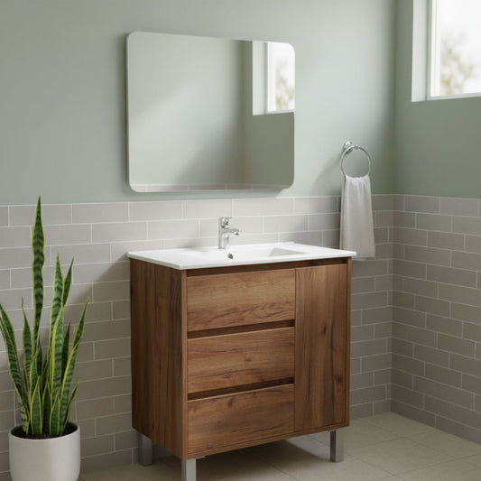 Móvel de casa de banho Menacho 80cm Verin Roble Ocre instalado, com espelho e decoração de casa de banho verde e cinzenta.