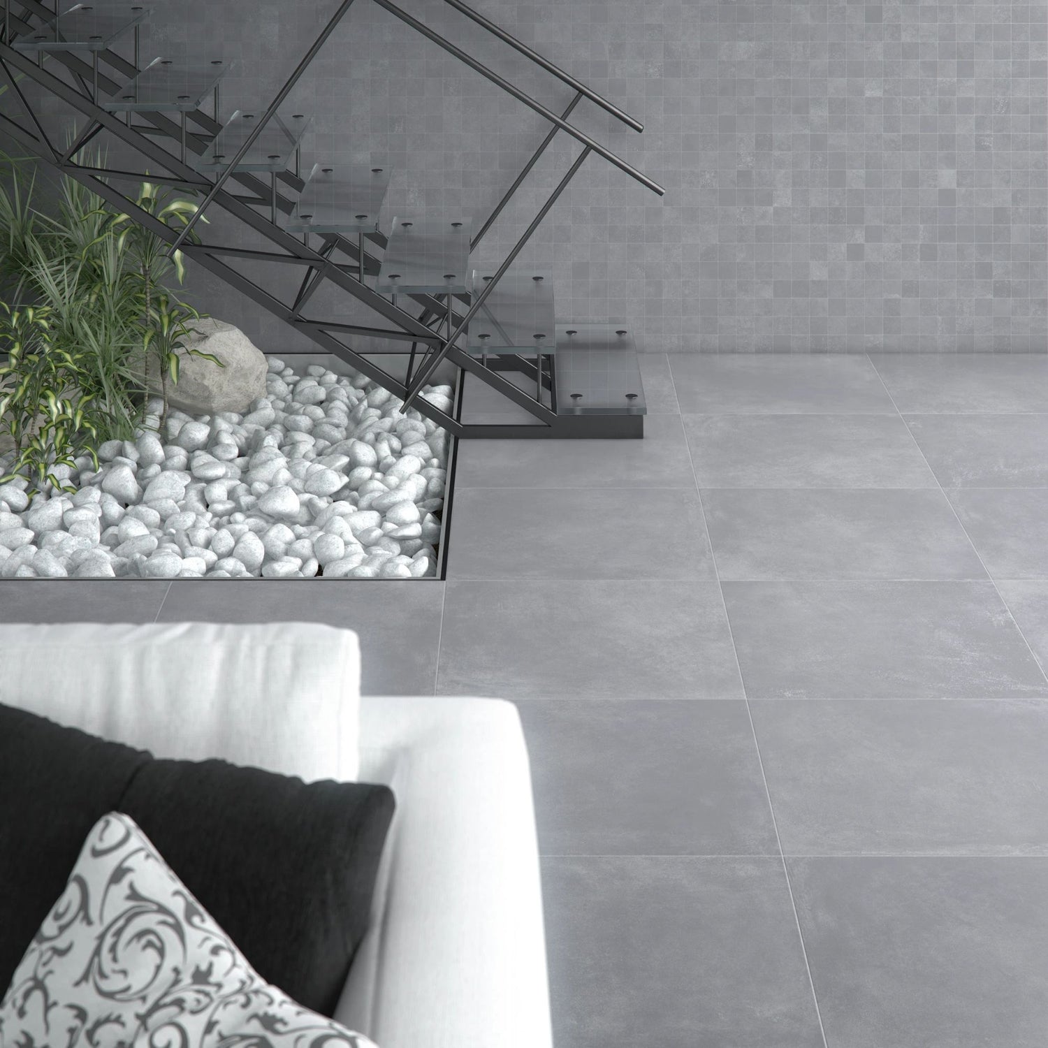 Espaço interior com jardim de pedras brancas e pavimento cerâmico Dominó Urban Light Grey 30x60cm