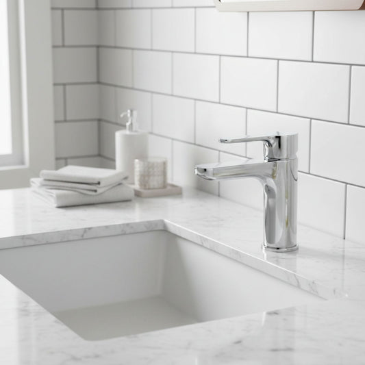 Torneira Roca L20 com manípulo XL instalada em lavatório de mármore branco em ambiente moderno e iluminado.