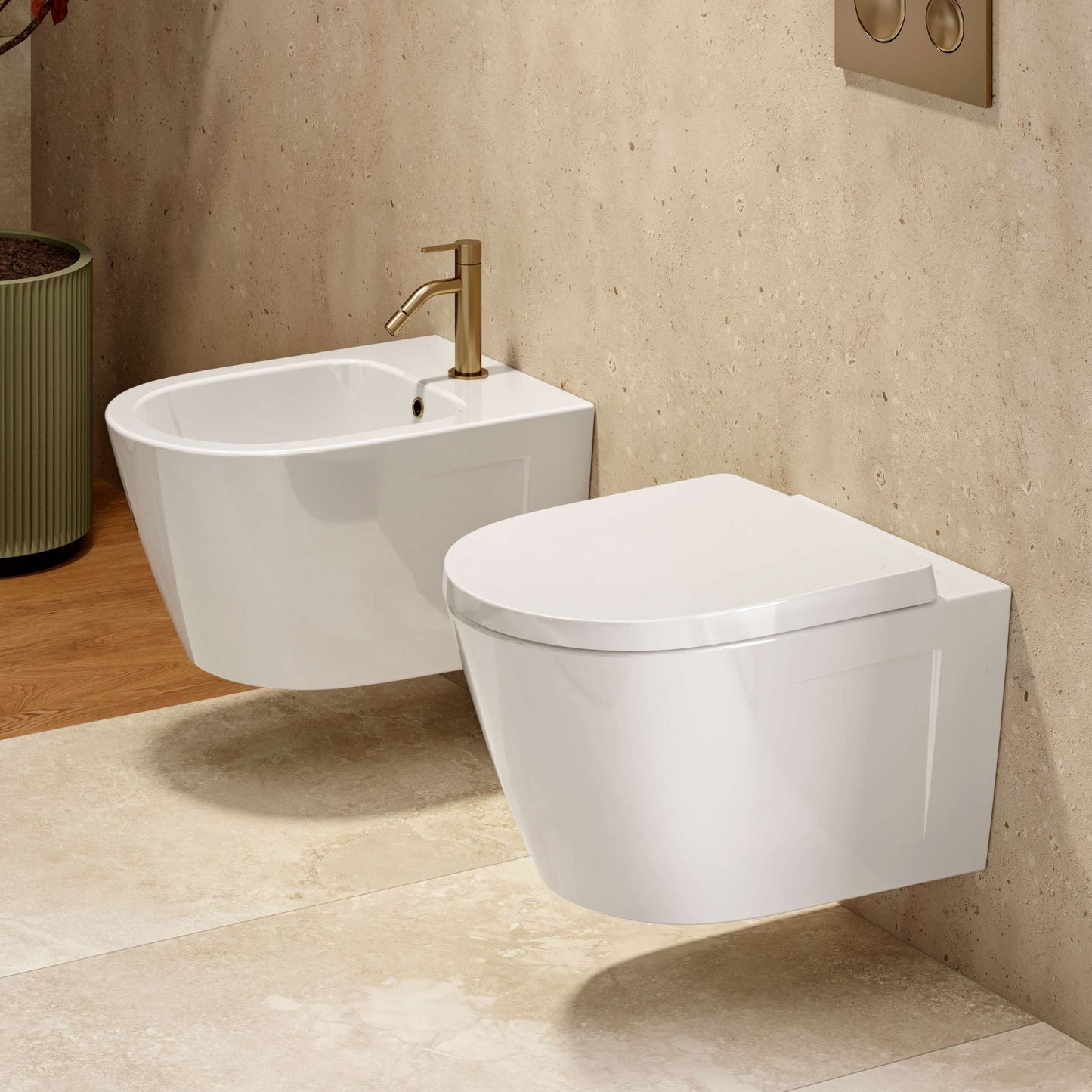 Sanita suspensa Ruby Vortex 53 branca instalada numa casa de banho moderna, ao lado do bidé suspenso da mesma série.