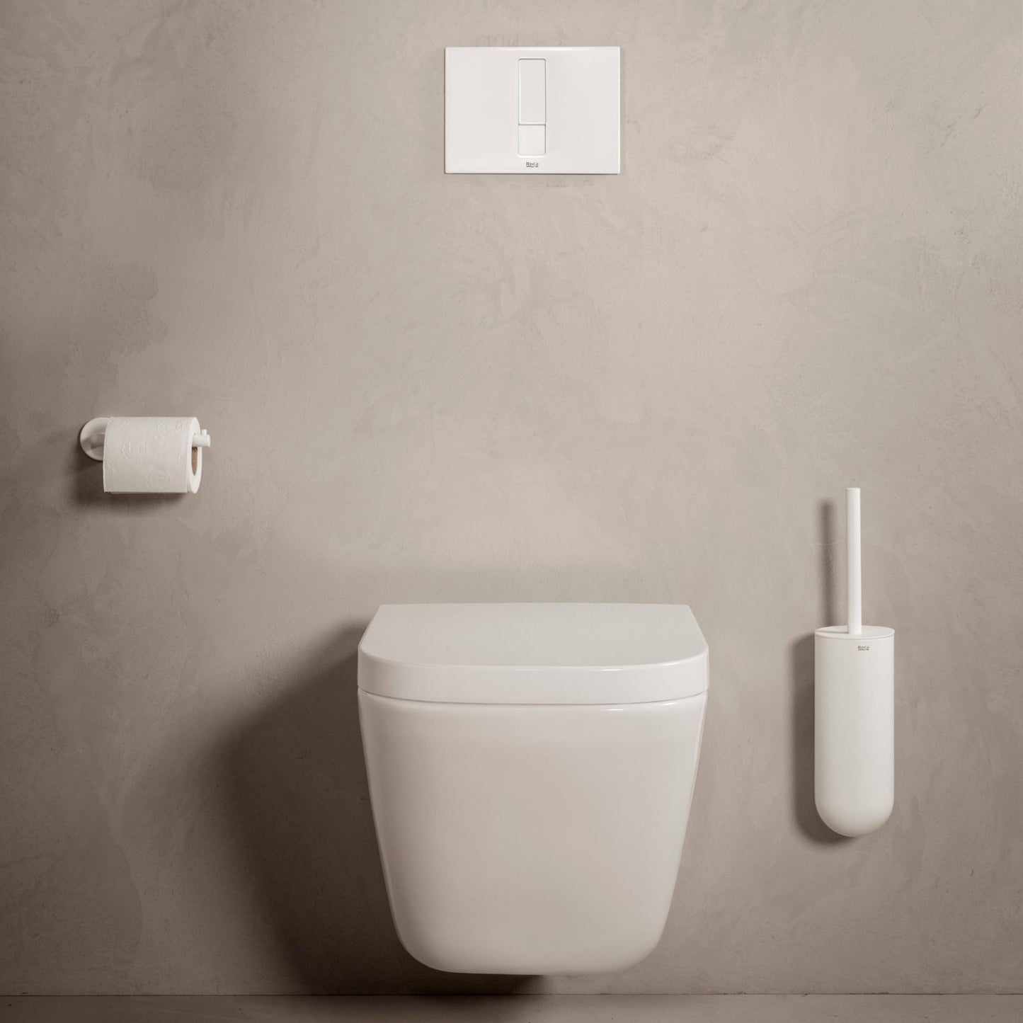 Casa de banho moderna com sanita suspensa branca equipada com tampo Roca Ona de design minimalista.